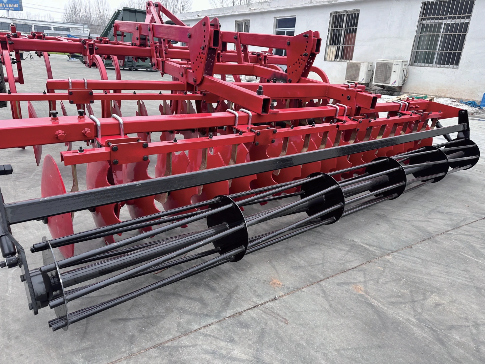 Subsoiling Combined Land Preparation Machine - Full Product Description This Subsoiling Combined Land Preparation Machine is a high-end compound tillage equipment purpose-built for breaking plow pan and deep soil improvement. It provides standard working width options from 2.5m to 3.45m, compatible with tractors above 120HP. It integrates two processes of deep subsoiling and topsoil leveling into one single machine, completely solves the industry pain points of hard plow pan and poor soil permeability caused by years of continuous rotary tillage, and serves as the flagship equipment for conservation tillage on high-standard farmland. Front Subsoiler + Rear Harrow Design, Finish Subsoiling & Tillage in One Pass The front part of the machine is equipped with high-strength subsoiler shanks, which can directly penetrate 350-450mm underground and completely break the hard plow pan formed by years of farming. The rear part is matched with 460mm high wear-resistant disc harrow group, which completes topsoil crushing and leveling simultaneously. It finishes both subsoiling and tillage in one field entry, eliminates the problem that extra large soil clods are left after subsoiling which requires secondary tillage, and drastically saves operation time and fuel cost. Thickened Heavy-Duty Structure with Ultra-High Reliability The main girder of the whole machine is integrally welded with 100mm100mm8mm thickened square steel tube. All connection points of subsoiler shanks and discs are reinforced for heavy load. Even under long-term full load operation on compacted hard plots and stony fields, there will be no shank deformation or frame crack, the overall durability is far better than ordinary subsoiling equipment. Multiple Precise Models to Meet Different Operation Demands The 3 models of the full series are equipped with 7, 9 and 11 subsoiler shanks respectively, the working width increases gradually from 2.5m to 3.45m, which accurately matches high-horsepower tractors in different power segments of 120-180HP and above 200HP. The subsoiler shanks are arranged with reasonable spacing, which forms uniform loose layer underground after operation without subsoiling blind spots, the soil permeability and water permeability are greatly improved, and the moisture retention and drought resistance performance is remarkable. Conservation Tillage Helps Long-Term Yield Increase Subsoiling operation does not turn over the soil layer and will not disturb the original soil tillage structure. It also mixes crop stubble and organic fertilizer into deep soil better to continuously improve soil fertility. After operation, rainwater infiltration speed increases several times, and soil water retention capacity is greatly enhanced in dry seasons. After 2-3 consecutive years of use, you can clearly observe that crop roots grow deeper, drought resistance and lodging resistance are improved, and it delivers remarkable long-term stable yield and yield increase effect. Typical Applications: Subsoiling conservation tillage in northeast China black soil region, plow pan breaking on years of rotary tilled fields, moisture retention tillage in arid and semi-arid areas, deep soil improvement for high-standard farmland, and farmland soil fertility restoration operations for large-scale farms.